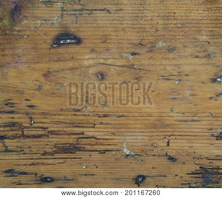 old board orange hardwood with woodworm path paint stains