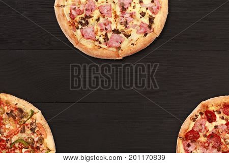 Pizza on wooden. Wooden table top view. On the table are the food for cooking. Healthy food. Dietetic foods. Above view on food. Hot Homemade Pepperoni Pizza Ready to Eat