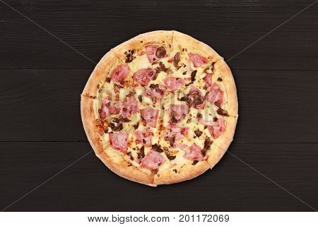 Pizza on wooden table top view. Fast food Delicious. Post blog social media. View from above with copy space. Banner template layout mockup top view on pizza. Pizza ready to eat.