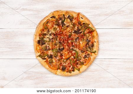 Pizza on wooden table top view. Fast food Delicious. Post blog social media. View from above with copy space. Banner template layout mockup top view on pizza. Pizza ready to eat.