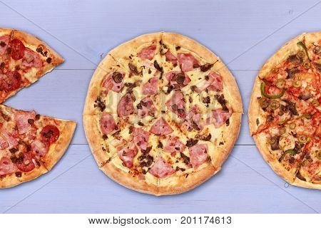 Pizza on wooden table top view. Fast food Delicious. Post blog social media. View from above with copy space. Banner template layout mockup top view on pizza. Pizza ready to eat.