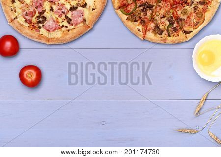 Pizza on wooden table top view. Fast food Delicious. Post blog social media. View from above with copy space. Banner template layout mockup top view on pizza. Pizza ready to eat.