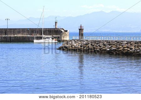 Boat Arriving To The Port In Lastres, Spain