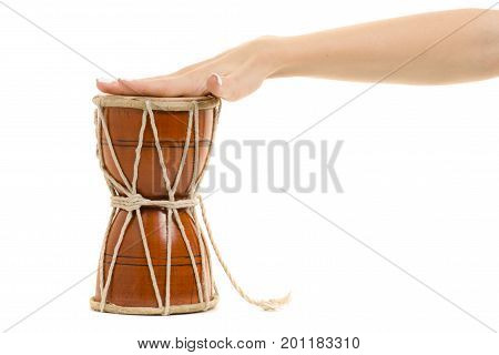 Female hands little drum on white background isolation
