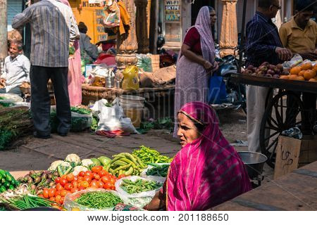 JAISALMER RAJASTHAN INDIA - MARCH 07 2016: Horizontal picture of indian woman at the street market in Jaisalmer known as Golden City in India.