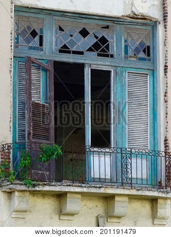 Colorful weathered door window balcony with stain glass