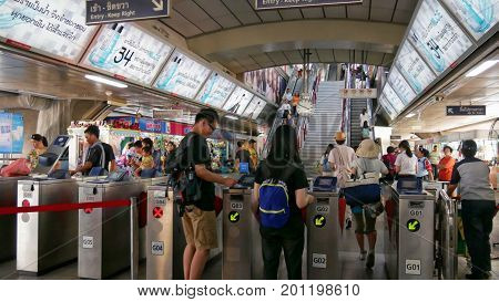 BANGKOK, THAILAND--Passengers go through the MRT subway train station ticket barriers in Bangkok Thailand in March 2016.