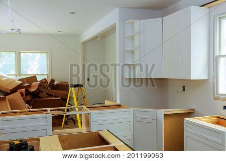 Custom Kitchen Cabinets In Various Stages Of Installation