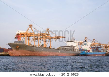 Logistic conceptContainer cargo ship docking port for loading containers from the ship.