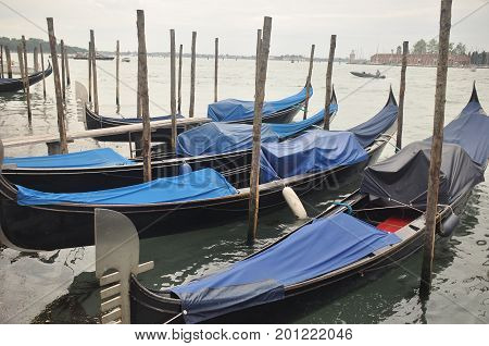 Narrow canals and alleyways in Venice. City of monuments in gondola.