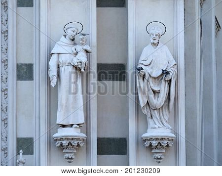 ROME, ITALY - SEPTEMBER 02: Statues of St. Anthony of Padua and St. Patrick on the facade of Sacro Cuore del Suffragio church in Rome, Italy  on September 02, 2016.