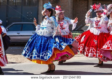 PUNO, PERU - AUGUST 07: Authentic Colorful Carnival on the streets of Puno, Peru near the high altutude Titicaca lake on August 7th, 2017