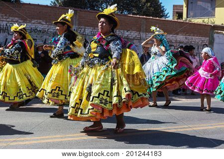 PUNO, PERU - AUGUST 07: Authentic Colorful Carnival on the streets of Puno, Peru near the high altutude Titicaca lake on August 7th, 2017
