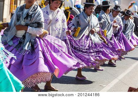 PUNO, PERU - AUGUST 07: Authentic Colorful Carnival on the streets of Puno, Peru near the high altutude Titicaca lake on August 7th, 2017