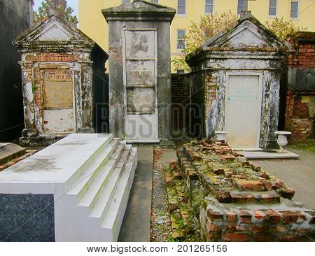 Old above ground cemetery with moss covering