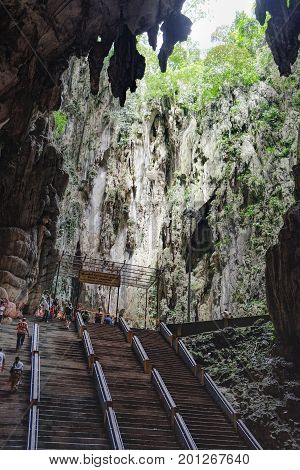 Batu Caves, Malaysia - February 7, 2016: Tourists visit to the the most popular Hindu shrines Batu Caves.