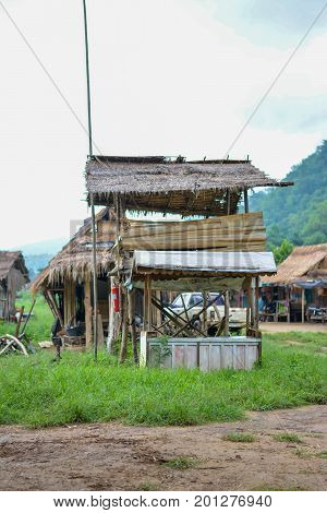 CHIANG MAI, THAILAND - July 10, 2017: Karen hill-tribe (Long Neck) woman weaving fabrics for a living at her house.