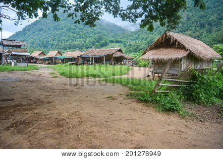 CHIANG MAI, THAILAND - July 10, 2017: Karen hill-tribe (Long Neck) woman weaving fabrics for a living at her house.