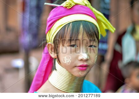 CHIANG MAI, THAILAND - July 10, 2017: Karen hill-tribe (Long Neck) woman weaving fabrics for a living at her house.