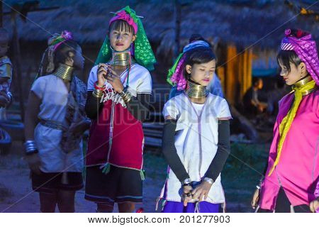 CHIANG MAI, THAILAND - July 10, 2017: Karen hill-tribe (Long Neck) woman weaving fabrics for a living at her house.