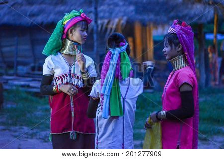 CHIANG MAI, THAILAND - July 10, 2017: Karen hill-tribe (Long Neck) woman weaving fabrics for a living at her house.