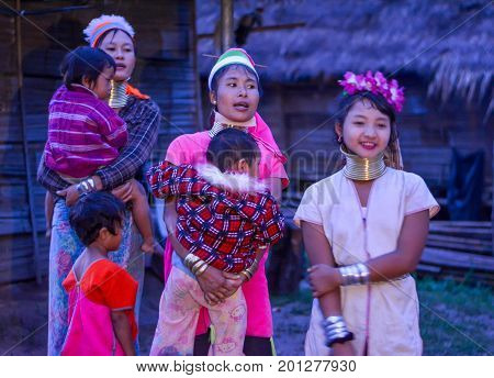 CHIANG MAI, THAILAND - July 10, 2017: Karen hill-tribe (Long Neck) woman weaving fabrics for a living at her house.