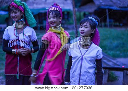 CHIANG MAI, THAILAND - July 10, 2017: Karen hill-tribe (Long Neck) woman weaving fabrics for a living at her house.