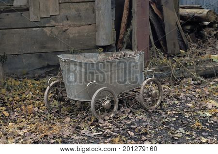 Vintage cart made from an old baby bath and wheels from a baby stroller