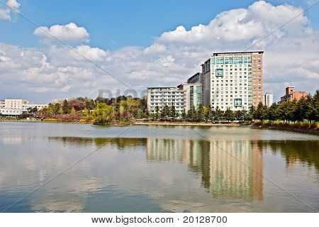 Modern Apartment Buildings Over Lake In A University Campus