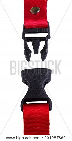 Side release buckle from plastic with Red belt nylon on the white background.