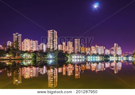 Beautiful City Lights Reflected On The Water Of The Lake At Night