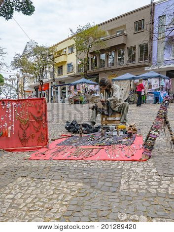 Hippie Selling His Art On Londrina Downtown