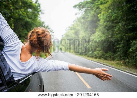 Asian women travel relax in the holiday. driving a car traveling happily.
