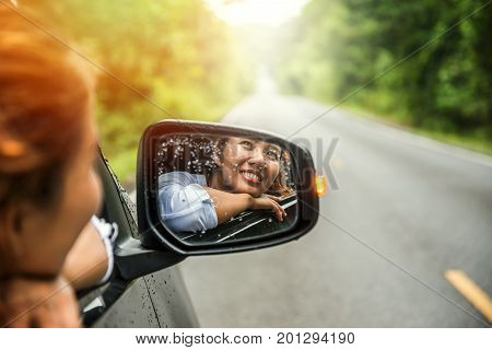 Asian women travel relax in the holiday. driving a car traveling happily.