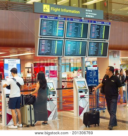 People At Airport Information Desk