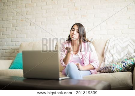 Woman Sending A Kiss To Her Boyfriend Online