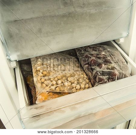 Hide food in deep freeze, get food from deep freeze, view through open door deep freeze