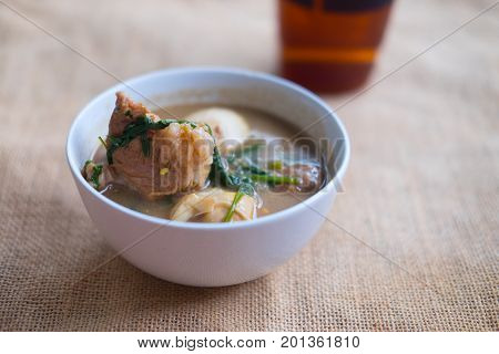 Braised Pork Belly With Egg And Tofu on white bowl