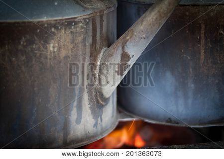 a stell iron kettle with fire on traditional angkringan seller photo taken in yogyakarta indonesia java
