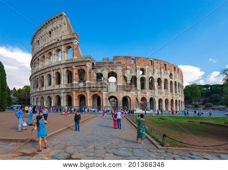 Rome Italy - September 12 2016: Tourists are taking pictures near of the famous sightseeing and monument in the world -  the Flavian Amphitheatre in Rome.