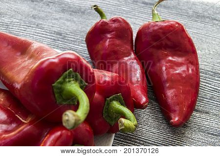 Red Hot Chili Peppers on white background 
 capia peppers in the plate