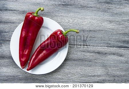 The most beautiful concept is Red fresh chilli on wood desk.