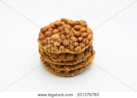 Brown fried peanut cracker on white background