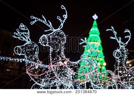 Lighting Decoration Deers With Christmas Tree On The Background In The City Of Gomel During New Year