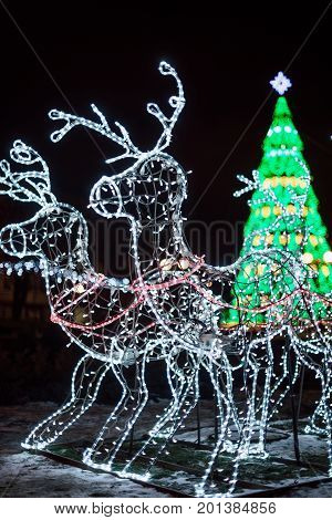 Lighting Decoration Deers With Christmas Tree On The Background In The City Of Gomel During New Year