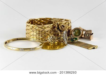 Luxurious And Expensive Golden Bracletes, Rings And Coin. Luxury Jewellery