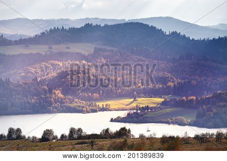 Lake Behind Foothills Of Tatra Mountains. Autumn Sunset