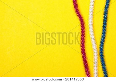 blue pink white rope on a yellow background