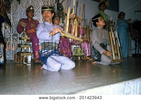SINGAPORE / CIRCA 1990: Malay musicians perform in a show at the Raffles Hotel.