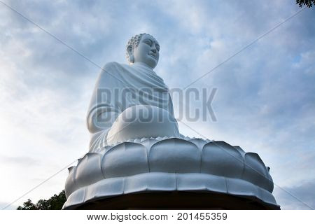 statue of the Buddha against the blue sky. Temple of the Buddha. Vietnam, Nha Trang, Pagoda.